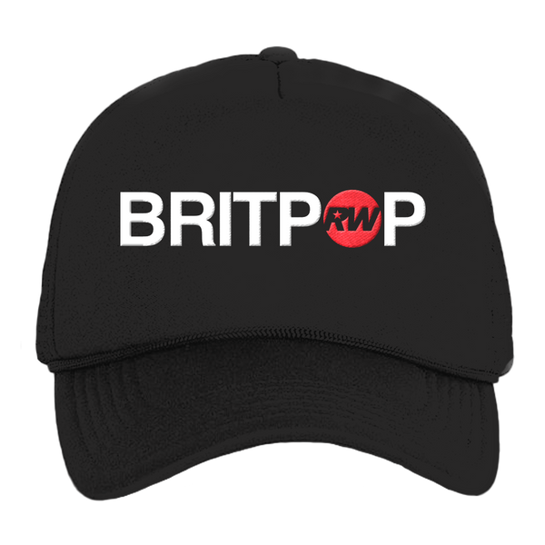 Front view of a black unisex regular-fit trucker cap featuring a 'Britpop' text print across the front, with the "O" replaced by a red circle containing a black RW logo. only available on RobbieWilliams.com